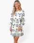 Beach Rose Co. cream mini dress with blue, navy, and taupe boho print, balloon sleeves, and gathered empire waist.