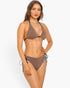 Beach Rose Co. Bronze Babe bikini with textured fabric, front charm, and adjustable side ties on a model.