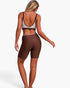 Beach Rose Co. two-piece yoga set with brown and beige color block sports bra and matching high-waisted biker shorts.