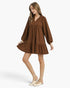 Beach Rose Co. brown corduroy babydoll dress with balloon sleeves, split neckline, and ruffled hem on a model
