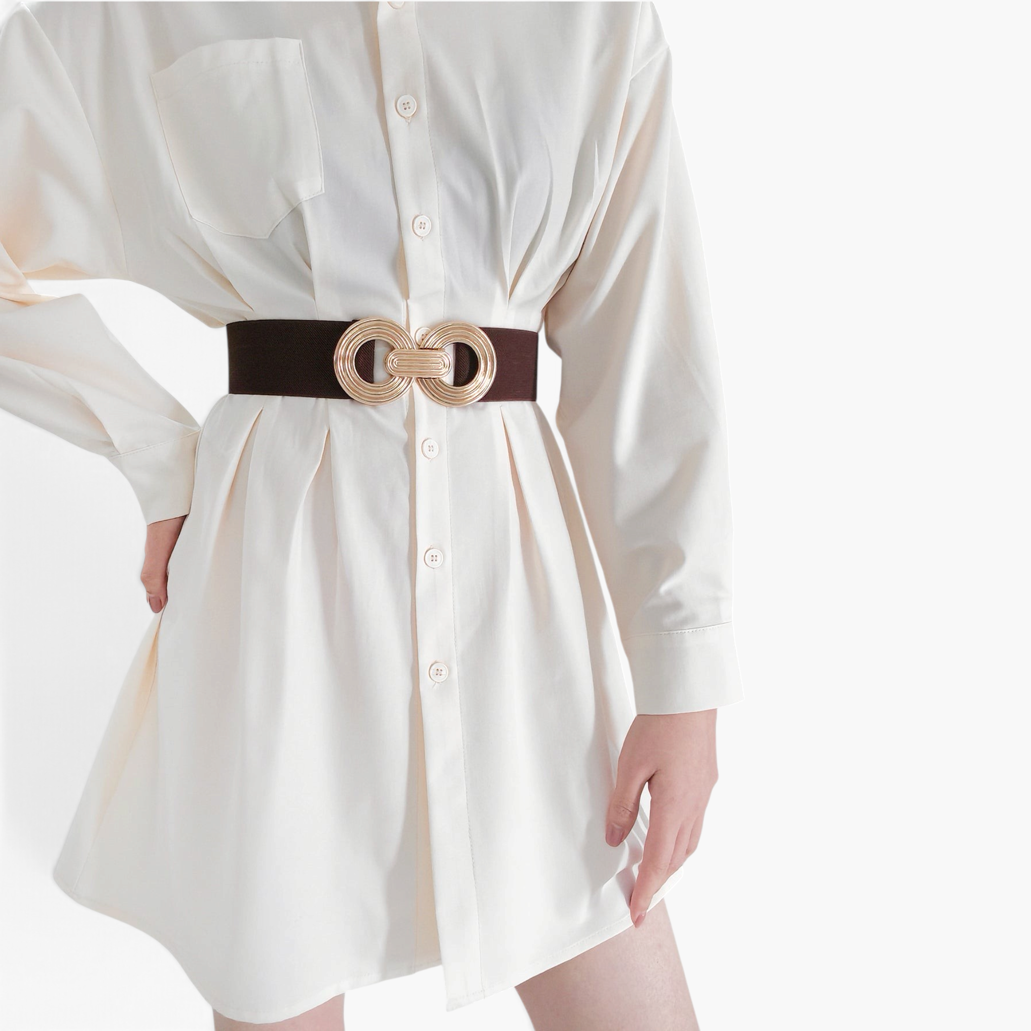 Beach Rose Co. wide brown elastic waist belt with a gold double-circle alloy buckle worn over a cream shirt dress.