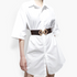 Beach Rose Co. brown elastic waist belt with a gold geometric double diamond buckle worn over a white shirt dress.