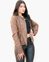 Beach Rose Co. brown faux leather jacket with zipper details worn by a woman with long dark hair