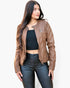Beach Rose Co. brown faux leather jacket worn by a woman with long dark hair, featuring a front zipper and quilted detail