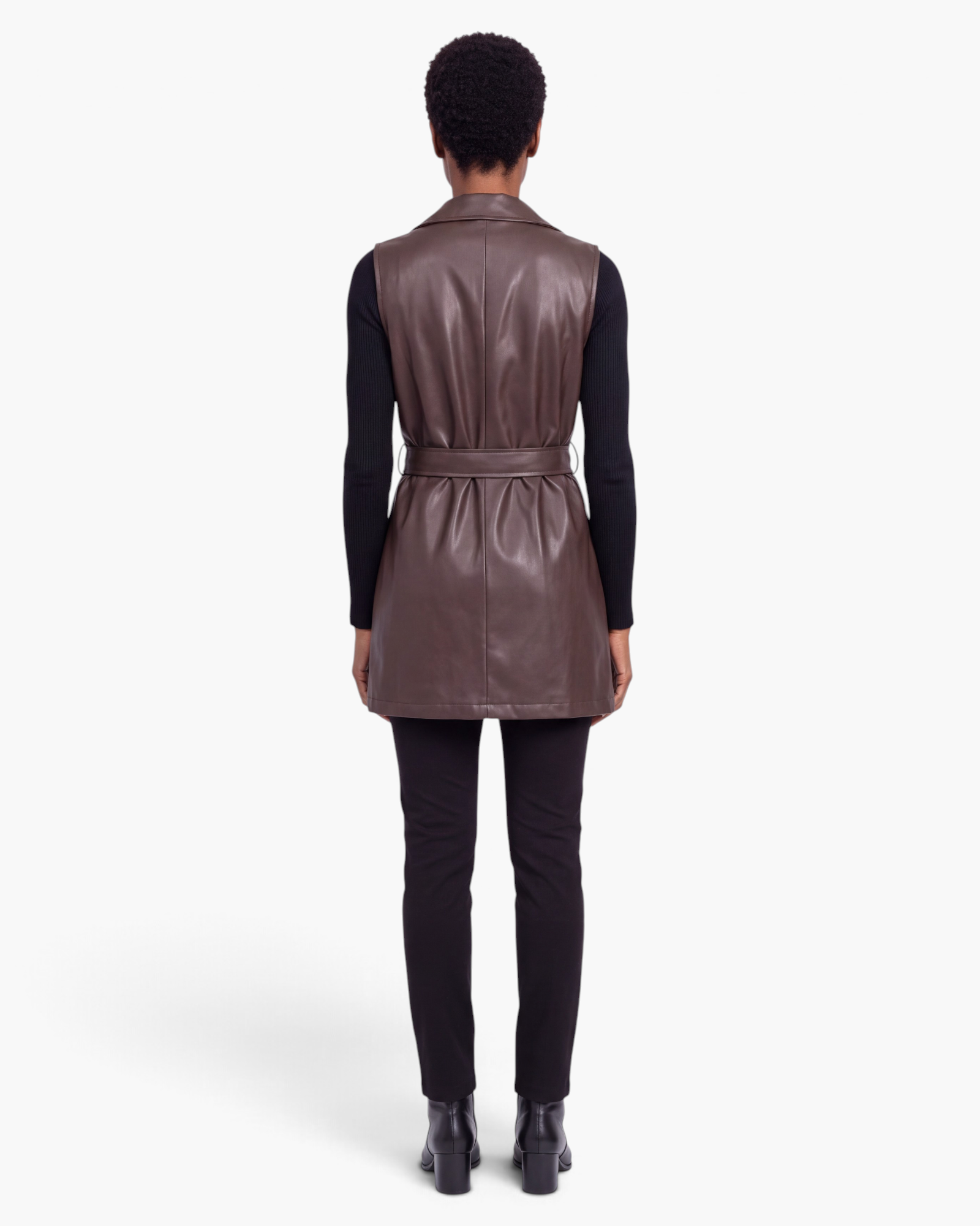 Beach Rose Co. brown faux leather longline vest with a belted waist and notched lapel, shown from the back.