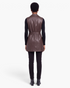 Beach Rose Co. brown faux leather longline vest with a belted waist and notched lapel, shown from the back.