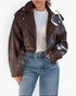 Beach Rose Co. brown faux leather cropped moto jacket with asymmetrical zipper, epaulets, and grommet belt.
