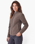 Model wearing a Beach Rose Co. brown faux leather moto jacket with a snap-tab stand collar and zip-front closure.