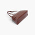 Beach Rose Co. brown faux leather sport bag with a sleek finish, zipper closure, and comfortable shoulder straps.
