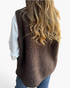 Beach Rose Co. brown polar fleece vest with a textured finish worn over a white long-sleeve shirt, back view.