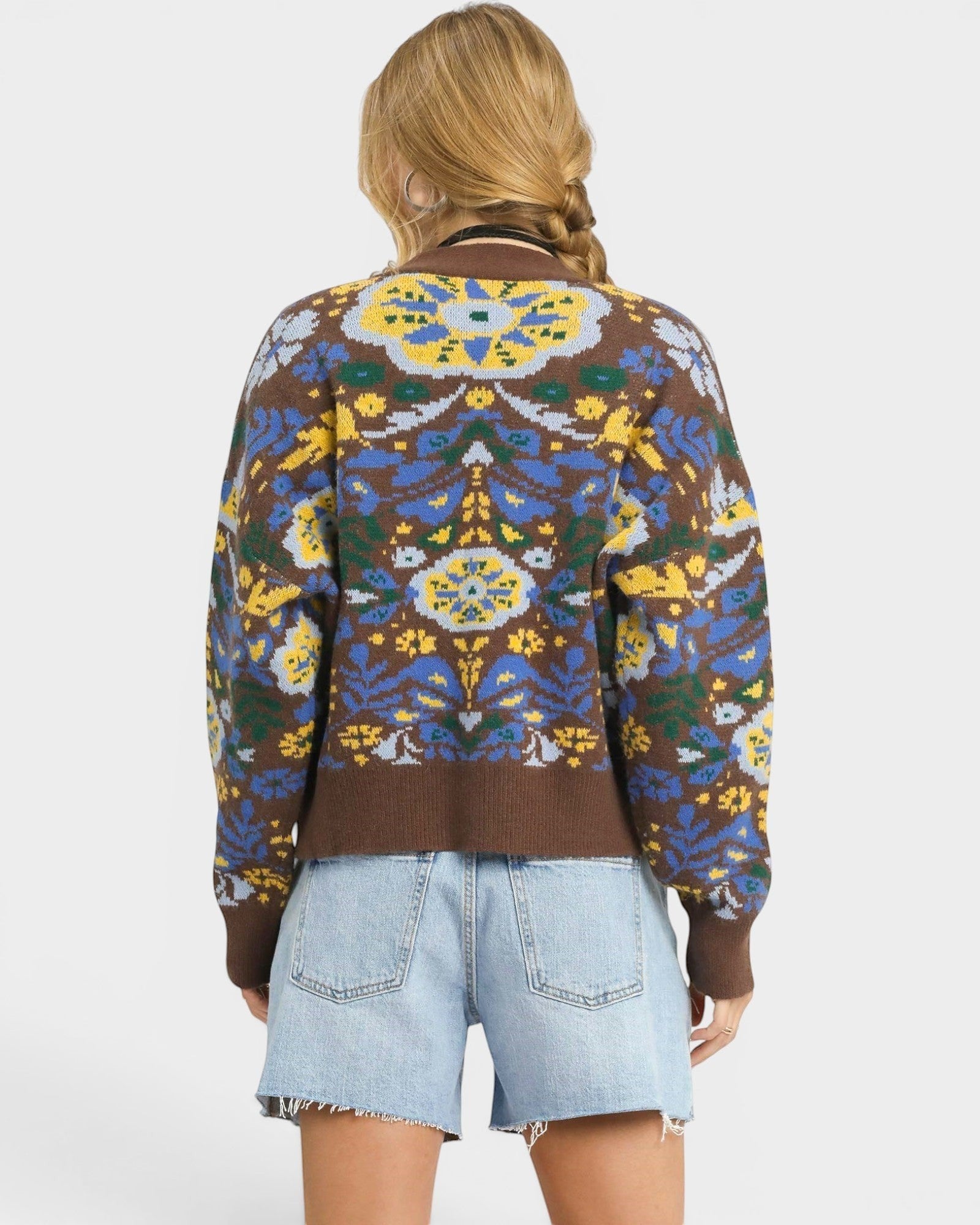 Beach Rose Co. brown knit cardigan with blue, yellow, and green floral pattern, V-neck, button front, and balloon sleeves.