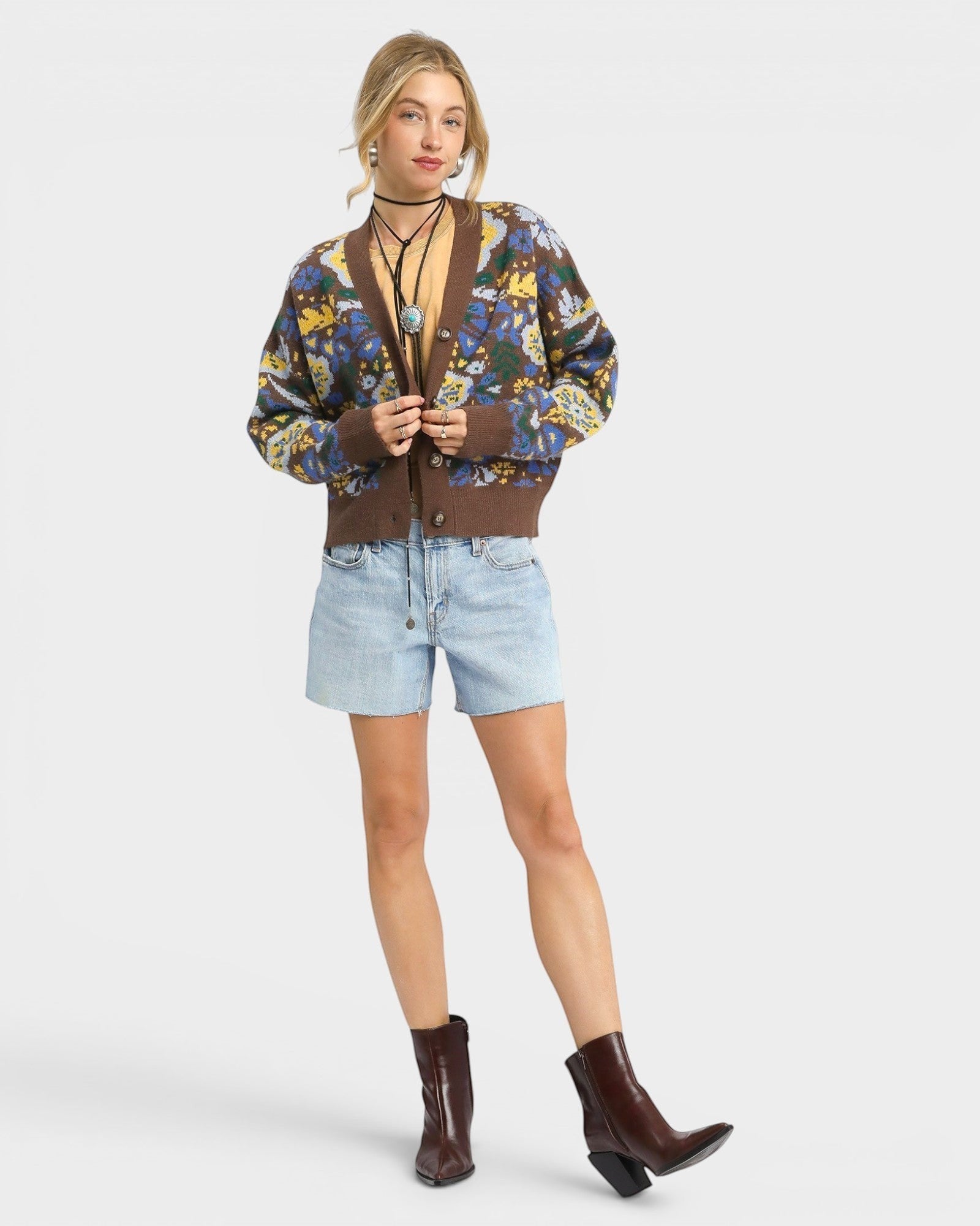 Beach Rose Co. brown knit cardigan with floral pattern, V-neck, button front, balloon sleeves, and ribbed trim.