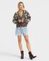 Beach Rose Co. brown knit cardigan with floral pattern, V-neck, button front, balloon sleeves, and ribbed trim.