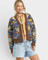 Beach Rose Co. brown knit cardigan with blue, yellow, and green floral pattern, V-neck, button front, and balloon sleeves.