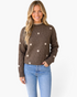 Beach Rose Co. brown knit sweater with cream floral embroidery and contrast stitching on the mock neck worn by a model