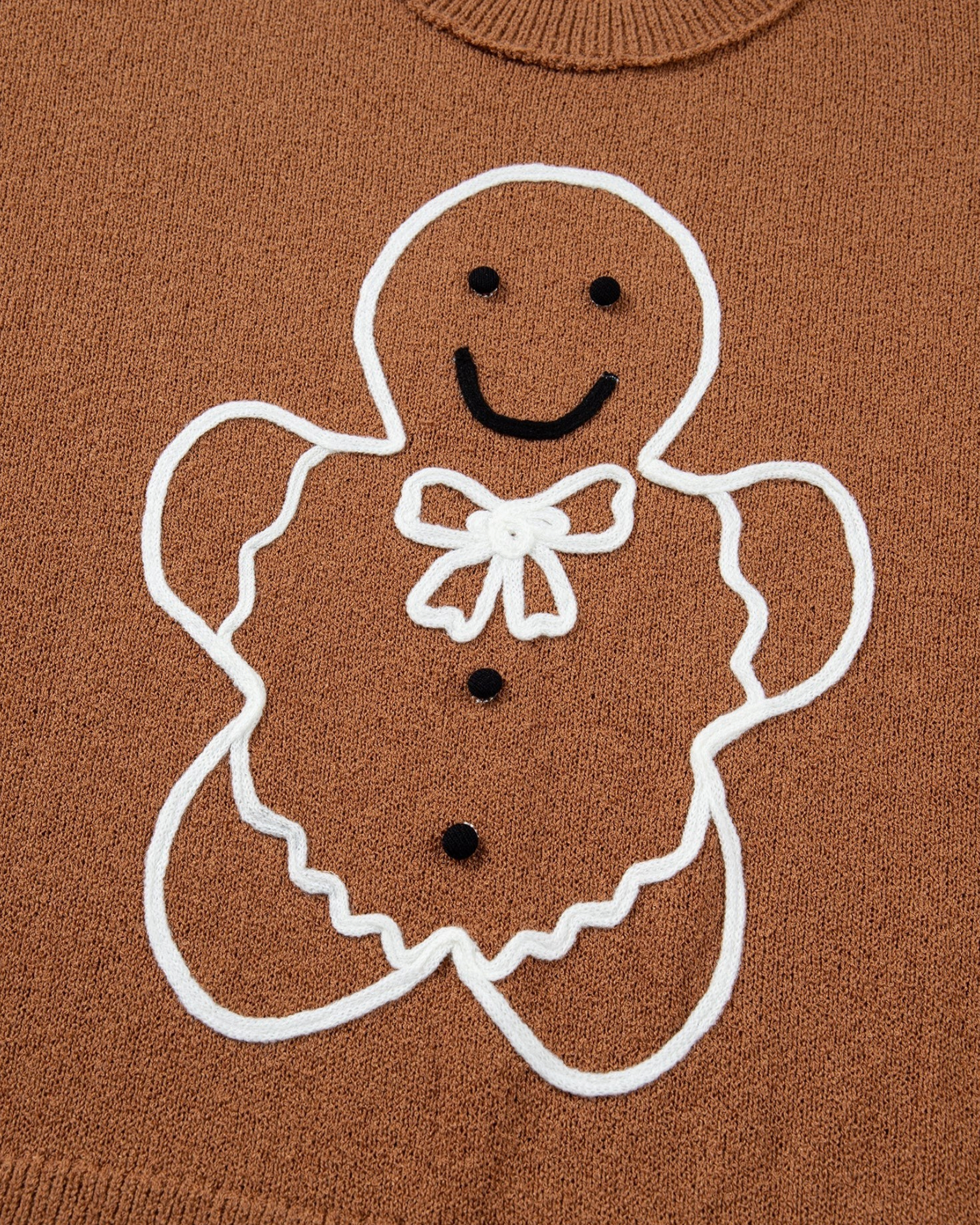 Beach Rose Co. brown crewneck sweater featuring a raised white gingerbread man design with a bow and icing details.