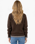 Beach Rose Co. brown textured knit sweater with gingham ruffle trim at the cuffs, worn by a woman from behind.