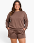 Beach Rose Co. plus size heathered brown lounge set featuring a crewneck sweatshirt and matching shorts with pockets.