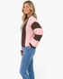 Beach Rose Co. textured crewneck sweater with brown and pink stripes worn by a blonde model with blue jeans.