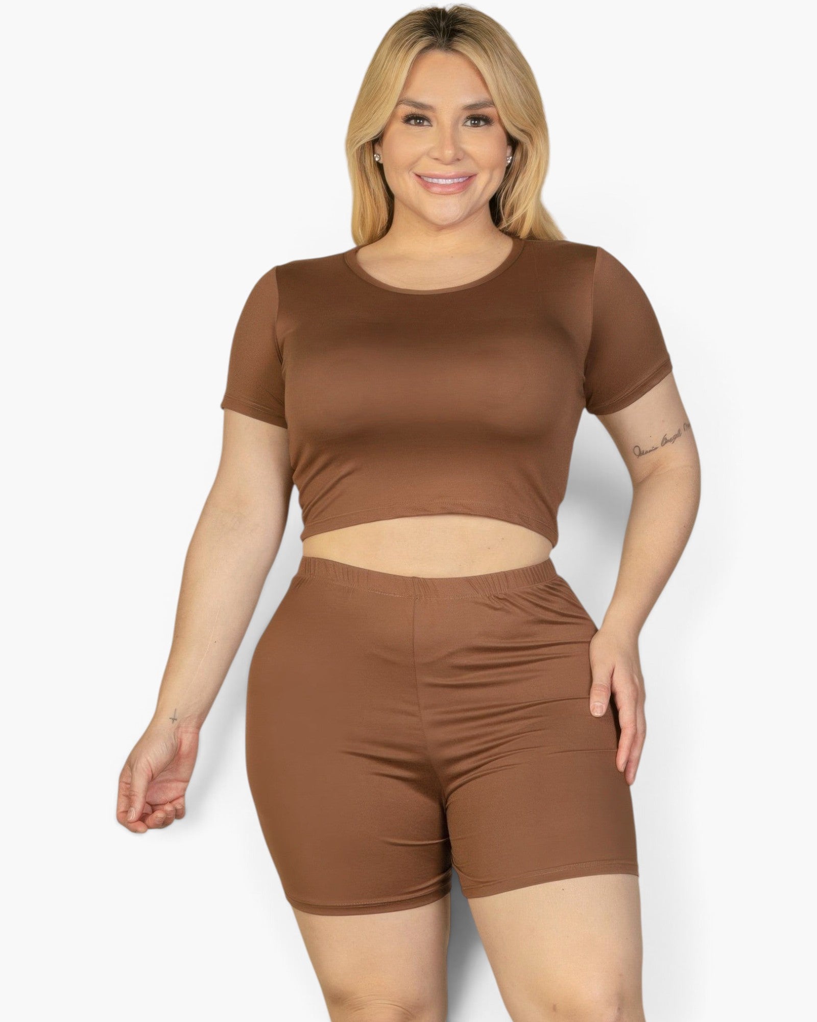 Beach Rose Co. plus size model wearing a brown short sleeve crop top and matching jersey shorts set