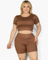 Beach Rose Co. plus size model wearing a brown short sleeve crop top and matching jersey shorts set