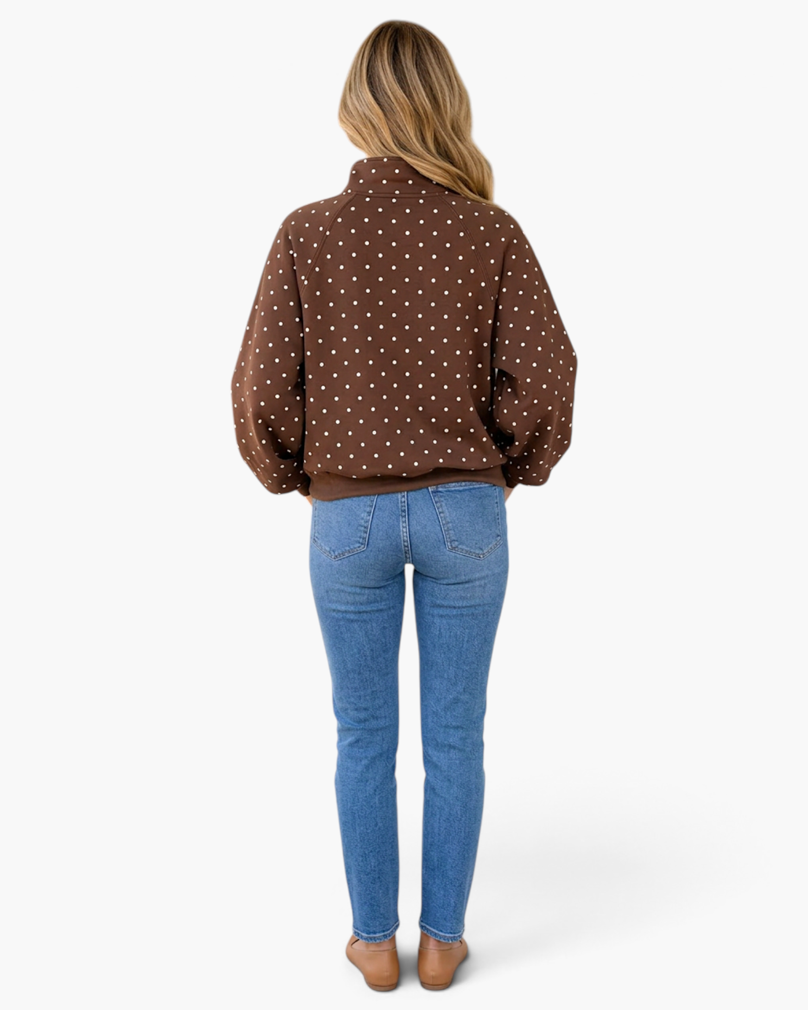 Beach Rose Co. brown pullover with white polka dots, pointed collar, and ribbed hem, worn with blue jeans, back view