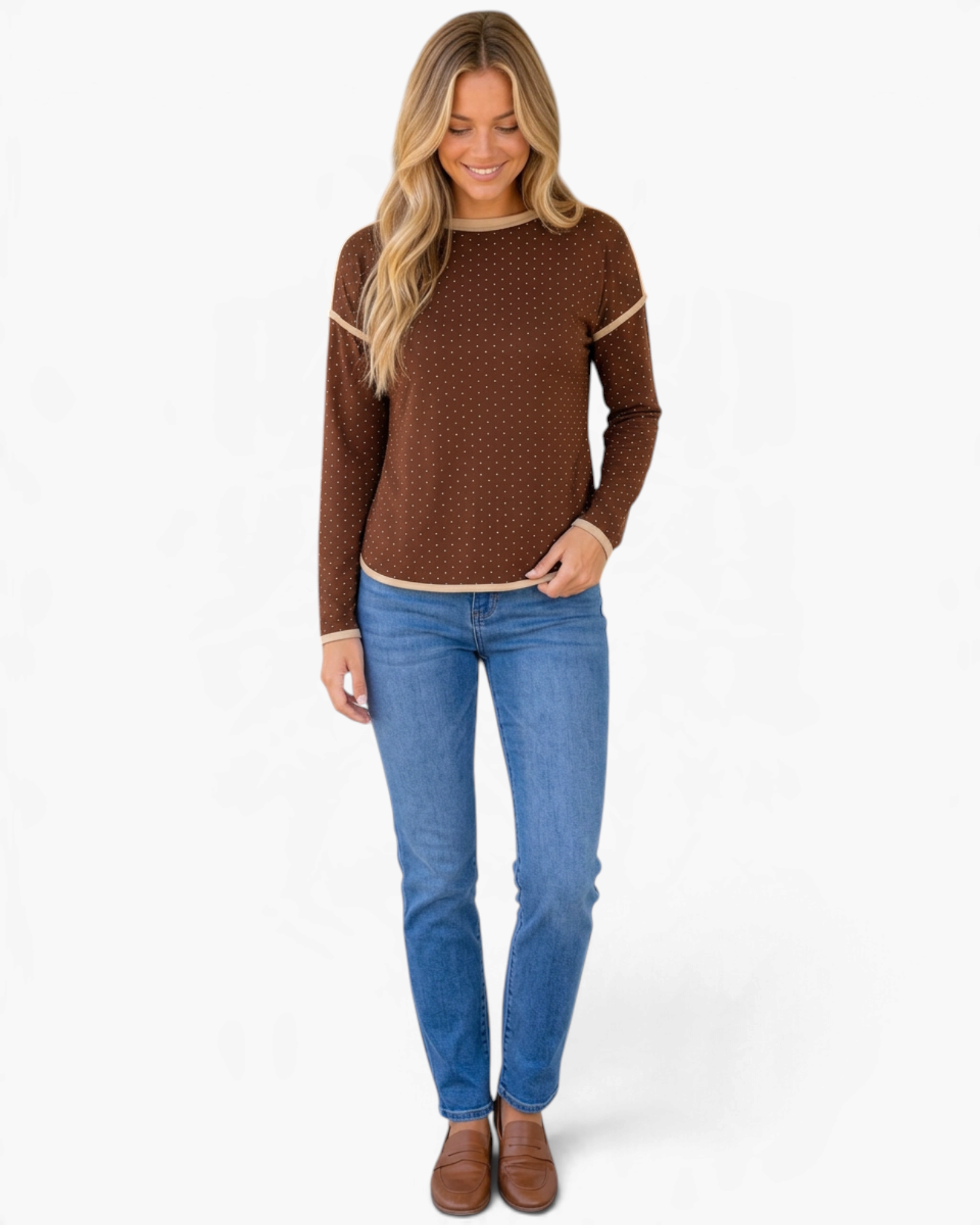 Beach Rose Co. brown long sleeve top with cream polka dots, contrast trim, and dropped shoulders on a smiling model.