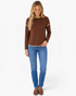 Beach Rose Co. brown long sleeve top with cream polka dots, contrast trim, and dropped shoulders on a smiling model.