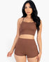 Beach Rose Co. brown ribbed cami crop top and matching ruched shorts set worn by a model against a white background.