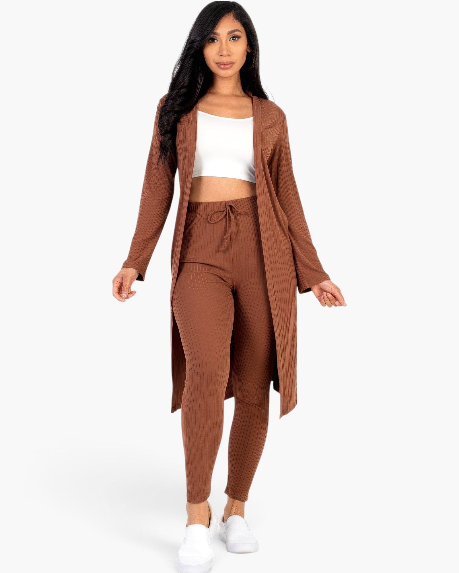 Beach Rose Co. brown ribbed long cardigan and leggings set worn by a model with a white crop top and sneakers