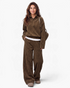 Beach Rose Co. brown ribbed two-piece set with collared button-placket top and wide leg pants worn by a woman.