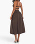 Beach Rose Co. brown sleeveless A-line dress with a backless design and ruched detail, worn by a model from behind.