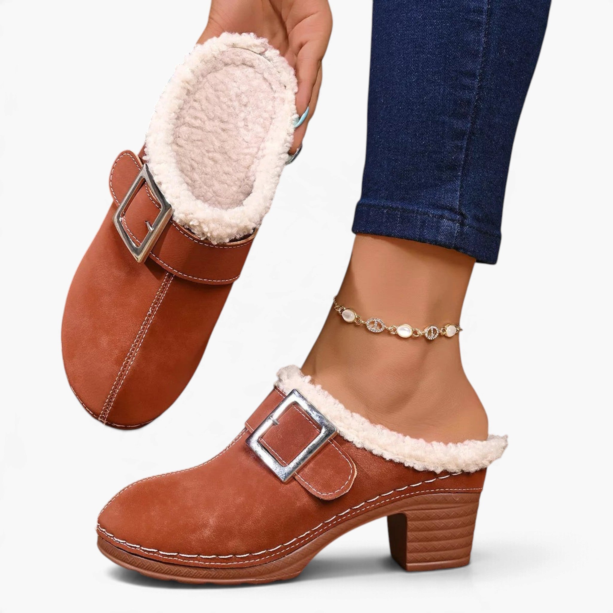 Beach Rose Co. brown suede clogs with fluffy white lining, oversized buckle, and chunky block heel on a model.