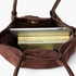 Beach Rose Co. brown suede shoulder bag with double handles, magnetic closure, and books inside for scale.