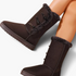 Beach Rose Co. dark brown suede mid-calf boots with faux fur trim and three side toggle fastenings on a model