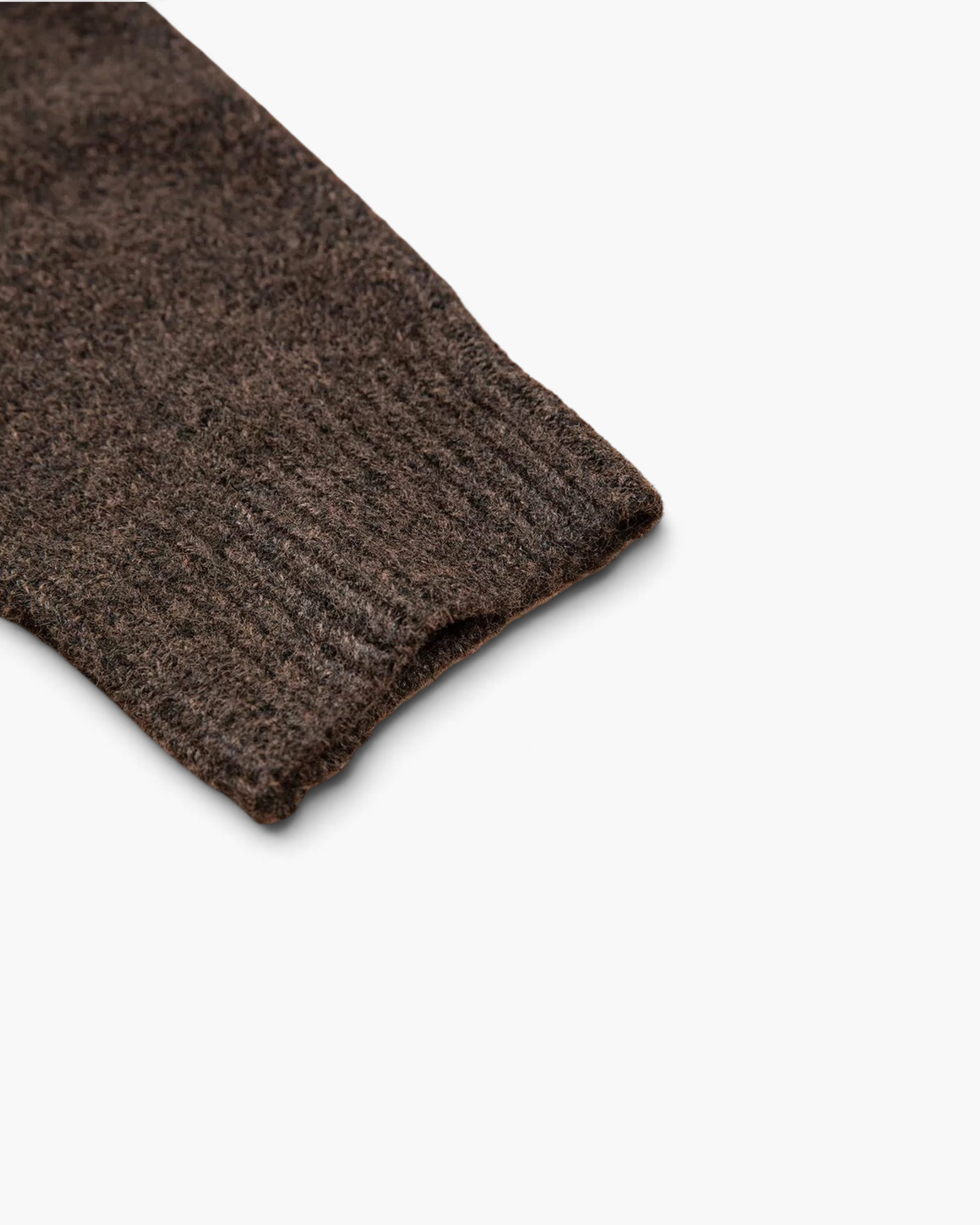 Beach Rose Co. brown knit sweater sleeve featuring a ribbed cuff and soft textured fabric.