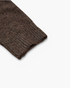 Beach Rose Co. brown knit sweater sleeve featuring a ribbed cuff and soft textured fabric.