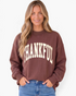 Beach Rose Co. brown mock neck sweatshirt with cream THANKFUL graphic worn by a smiling woman with blonde hair.