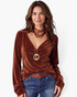 Beach Rose Co. brown velvet long sleeve V-neck top worn by a woman with layered necklaces and blue jeans