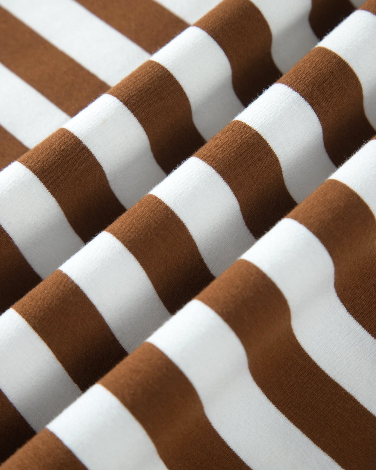 Beach Rose Co. plus size sweatshirt fabric featuring brown and white horizontal stripes in a soft cotton blend.