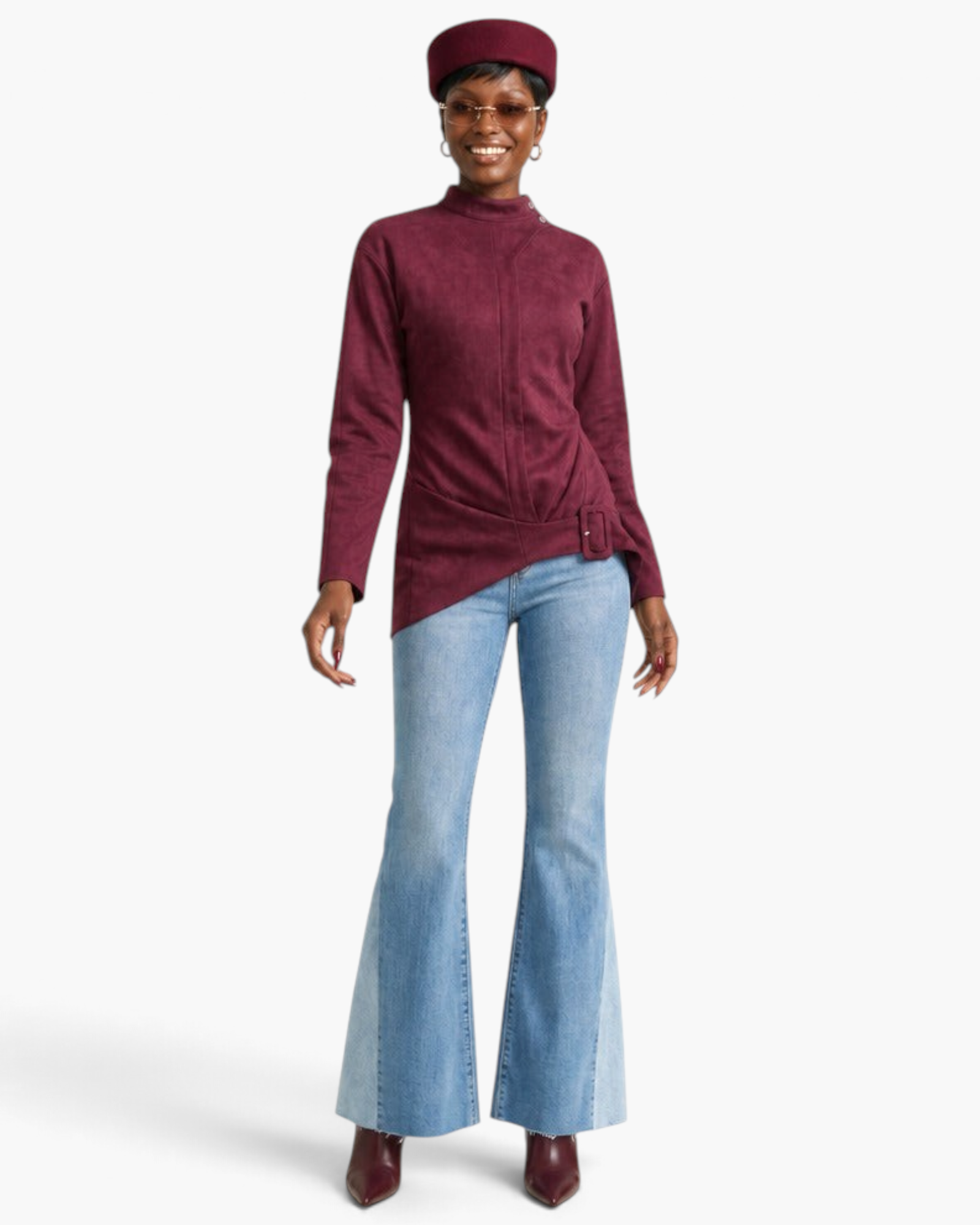 Beach Rose Co. burgundy fitted jacket with mock neck, shoulder snaps, and asymmetrical buckle hem worn by a model.
