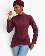 Beach Rose Co. burgundy fitted jacket with mock neck, shoulder snaps, and asymmetrical buckle hem worn by a model.