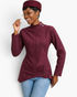 Beach Rose Co. burgundy fitted jacket with mock neck, shoulder snaps, and asymmetrical buckle hem worn by a model.