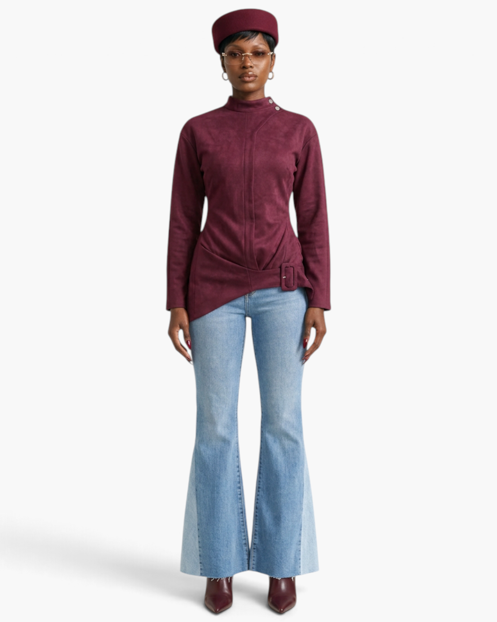 Beach Rose Co. burgundy fitted jacket with mock neck, shoulder snaps, and asymmetrical buckle hem on a model