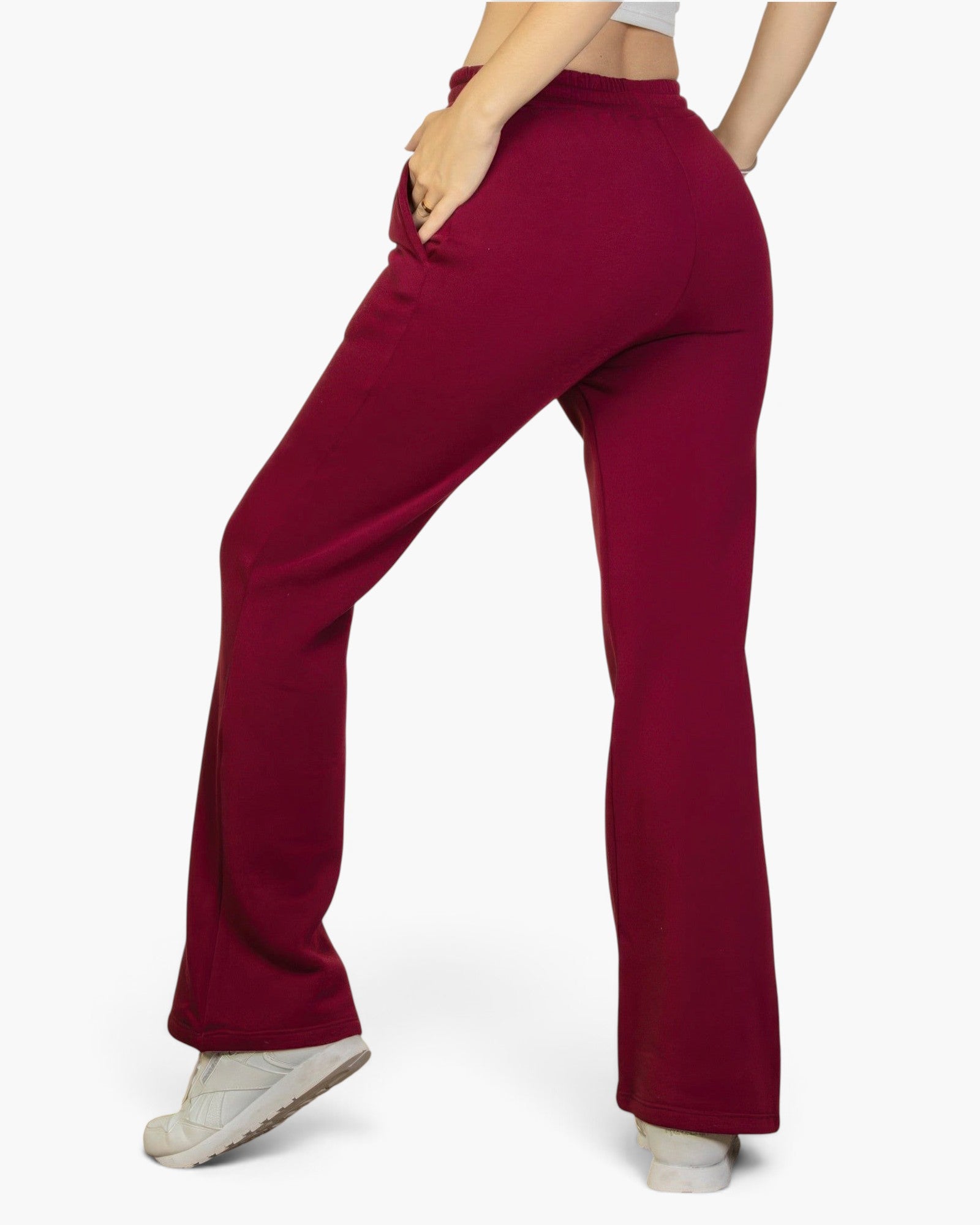 Beach Rose Co. burgundy bootcut sweatpants with a drawstring waist and slant pockets worn by a woman
