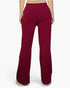 Beach Rose Co. burgundy bootcut sweatpants with a drawstring waist, shown from the back on a model.