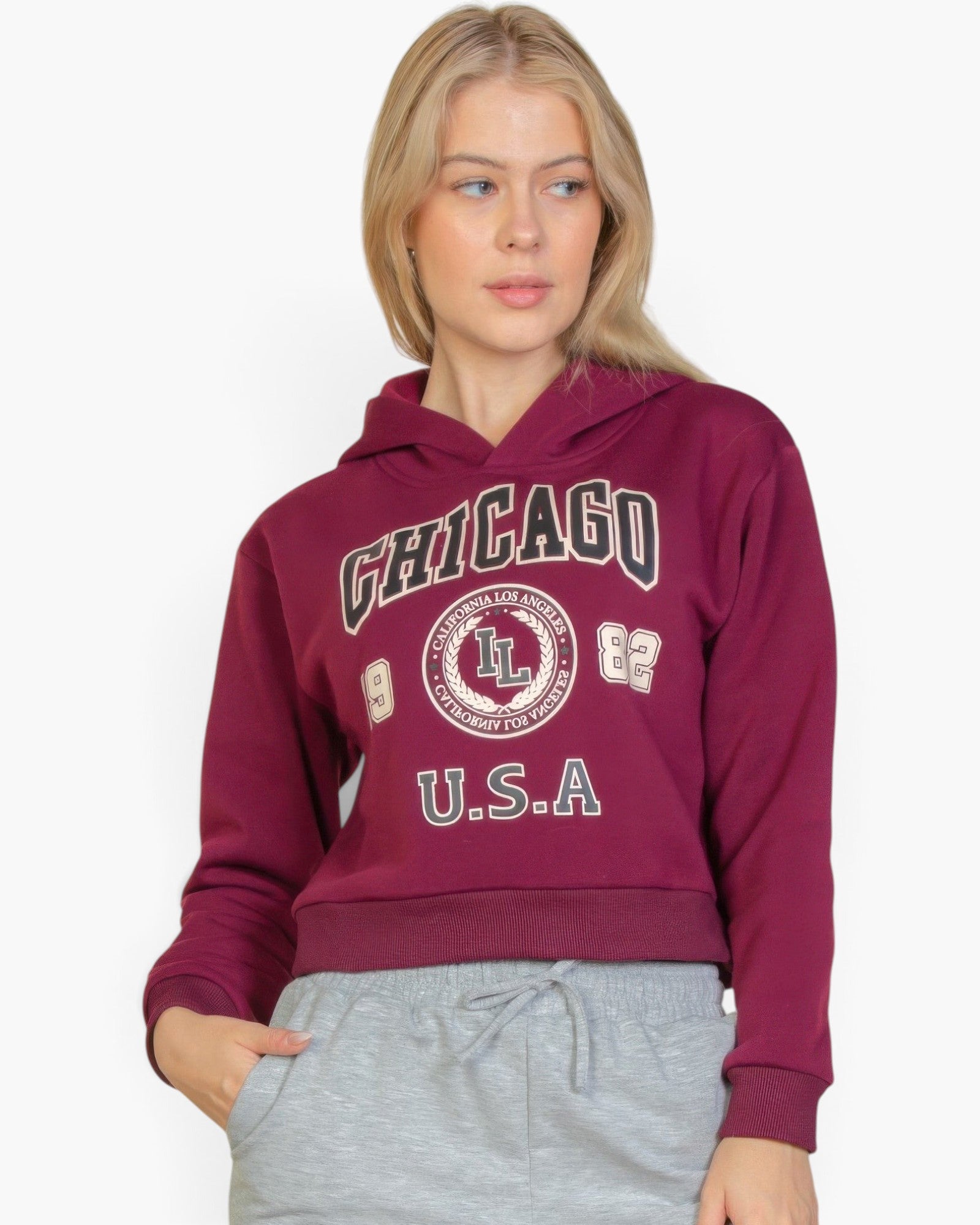 Beach Rose Co. burgundy drop shoulder pullover hoodie with Chicago graphic print worn by a blonde woman
