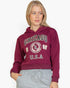 Beach Rose Co. burgundy drop shoulder pullover hoodie with Chicago graphic print worn by a blonde woman