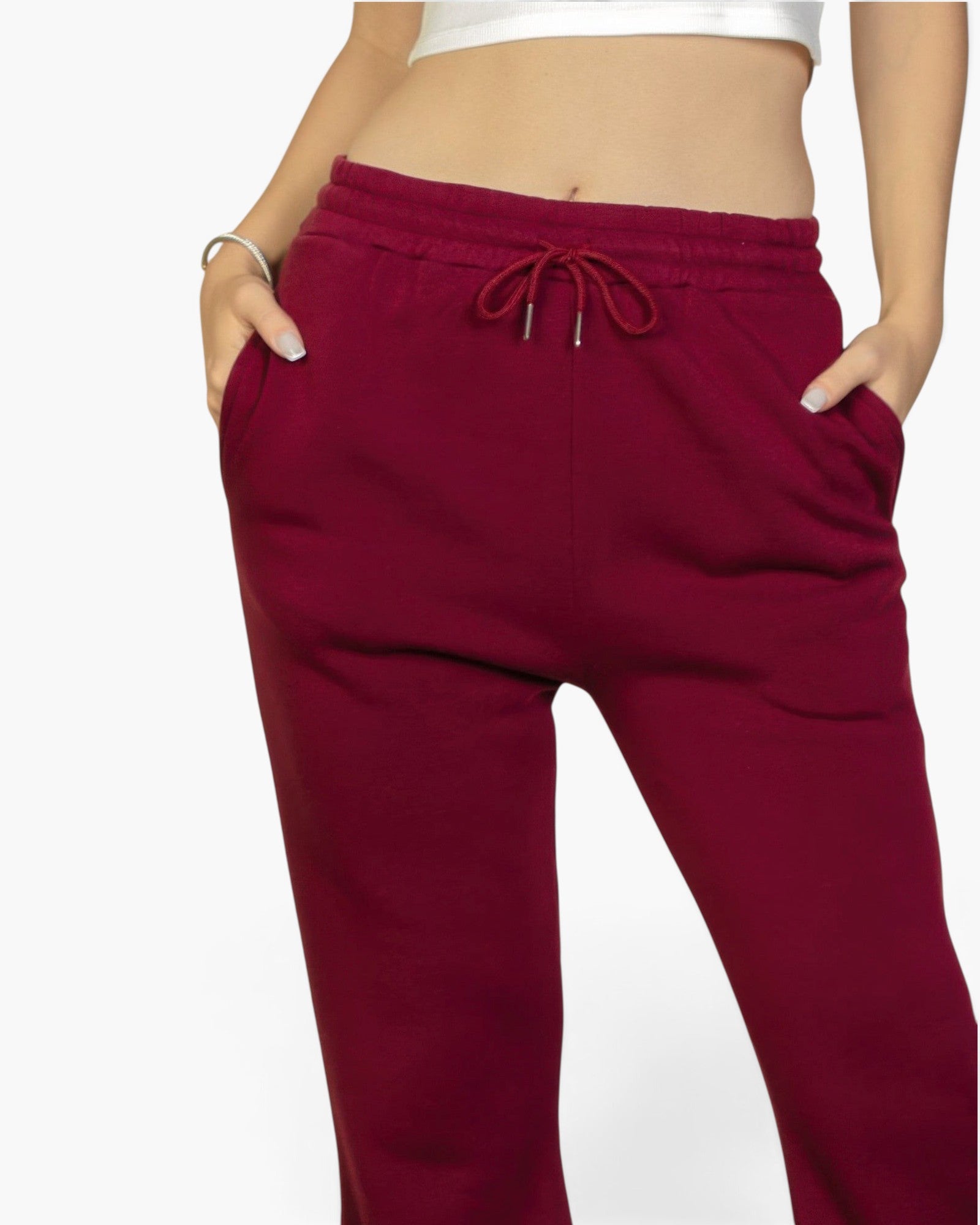 Beach Rose Co. burgundy polyester sweatpants with a drawstring waist and slant pockets on a model