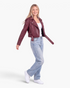 Beach Rose Co. burgundy faux leather moto jacket with asymmetrical zipper, belt, and cropped silhouette.